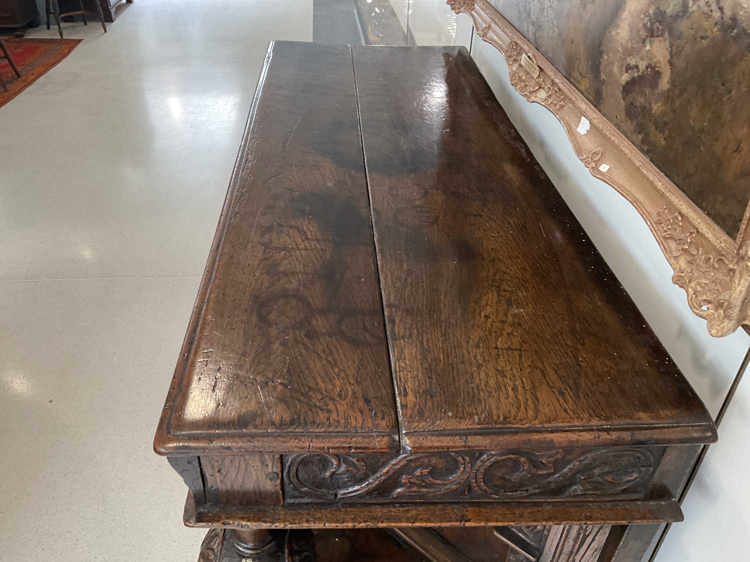 A Joined Oak Standing Livery Cupboard, early 17th century, the boarded top above a carved frieze and - Image 7 of 14