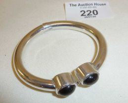 Modernist sterling silver torq style bracelet with tiger's eye cabochon terminals, approx. 57g