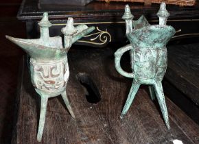 Two Chinese bronze Jue libation cups on tripod legs