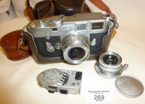 Leica M3 cased camera (1964) with a Leitz 1:4/21 lens along with a leather cased Leitz 1:35 lens and