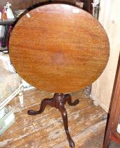 Georgian mahogany tripod table having bird cage top and standing on pad feet