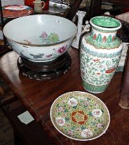 Large Chinese famille rose porcelain punch bowl with birds & flowers, cracked with rivets, on carved