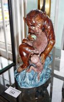 Continental majolica figure of a monkey with baby, 20cm high
