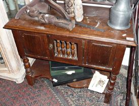 18th c. oak low cupboard, the central door having turned spindles standing on bobbin turned legs