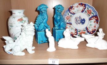 Pair of Chinese turquoise glazed Fo dogs, a celadon similar, three Chinese blanc de chine figures,