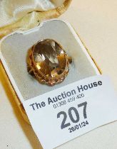 9ct gold dress ring set with a smoky topaz? stone. Approx. UK size N and weight 5.5g