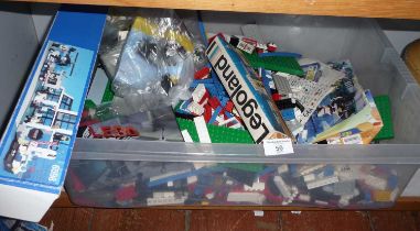 Crate of Lego pieces and boards