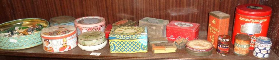 Old tins, one containing diecast farmyard animals