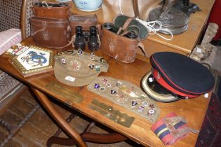Militaria:- three caps (two with enamel badges attached), three pairs of field glasses, button