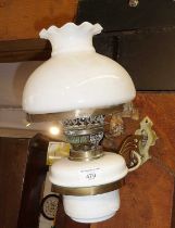 Edwardian brass wall oil lamp (converted), having white glass reservoir and shade