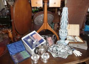 Assorted glassware, cased cutlery, a silver plated teaset and a pottery table lamp