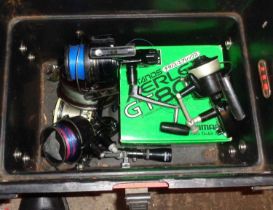 Storage box with seat lid containing sea fishing reels