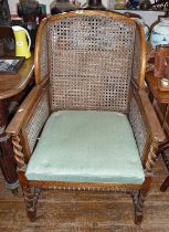 1930s walnut Bergere double canework wing armchair, with barley twist legs & stretchers