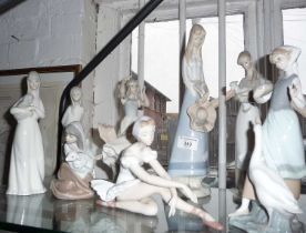 8 various Lladro and similar china figurines of girls