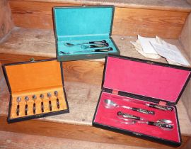 Three cases of Haddad Jezzin cutlery, and several silk postcards