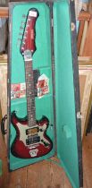 A vintage Thomas electric guitar in wooden case