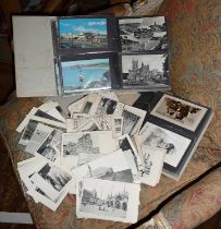 Two albums of antique and vintage postcards together with an assortment of European Geographical