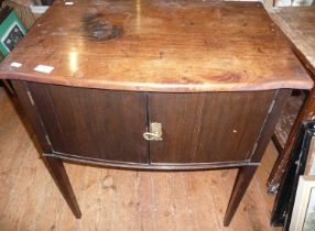 Edwardian mahogany bow-fronted two-door cabinet on square tapering legs