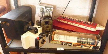 Polaroid Swinger camera model 20, a Hohner Melodica-Alto, an LTL Acorn Scouting camera and a Satanix