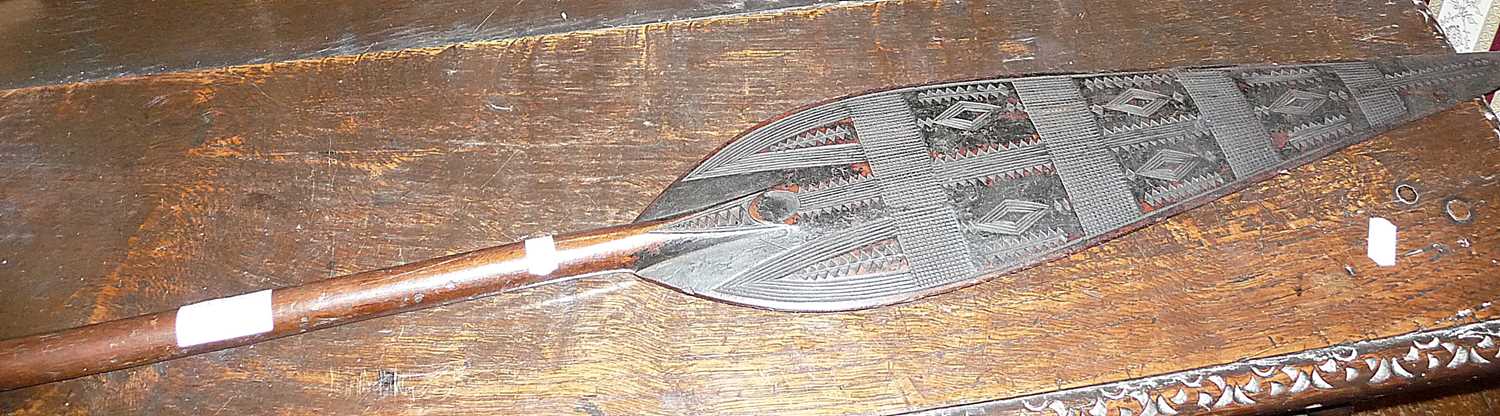 Tribal Art: African leaf paddle with carved decoration