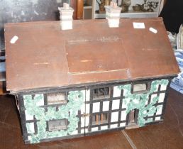 Early 20th c. "Tudor" dolls house with fitted illuminated interior