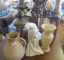 Verwood pottery pitcher, Art Deco St Clements china stylised parrot, brass oil lamp and a tall glass