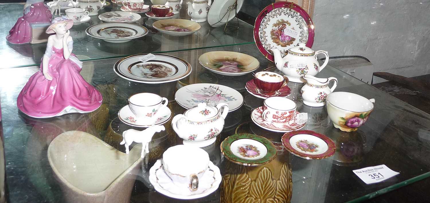 Collection of miniature china cups and saucers, etc.