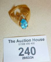 14ct gold ring with a marquise cut blue topaz, approx. UK size L and weight 3.5g