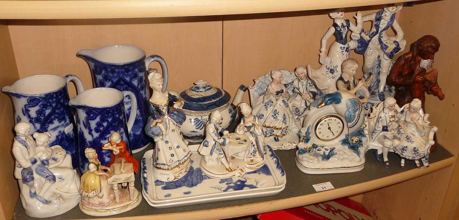Set of three graduated flo-blue jugs. and a collection of blue & white china figures