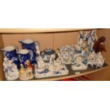 Set of three graduated flo-blue jugs. and a collection of blue & white china figures