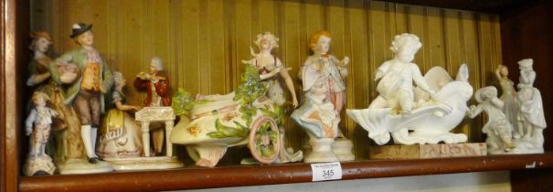 Porcelain figural groups and a marble stand, together with a porcelain cherub posy vase and other