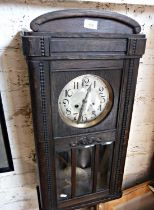 Oak cased 8-day wall clock, striking on a gong with glass door enclosing pendulum