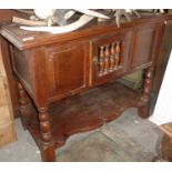 19th c. small oak dresser having single door with chicken coop turnings above shaped undertier,