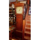 Oak 30 hour grandfather clock with swan neck pediments, hand painted dial, and pendulum and weight