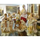 Four German porcelain figures of lady musicians and a Continental porcelain figurine of a lady