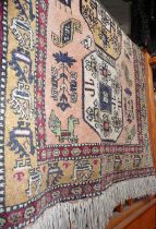 Persian rug on a cream ground, 71" long x 46" wide