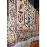 Persian rug on a cream ground, 71" long x 46" wide