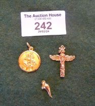 18ct gold St. Christopher, Cornicello charm, and a 10ct totem pole charm. Combined weight approx.
