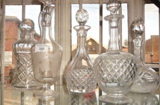 Etched glass claret jug on stemmed foot and four various cut glass decanters