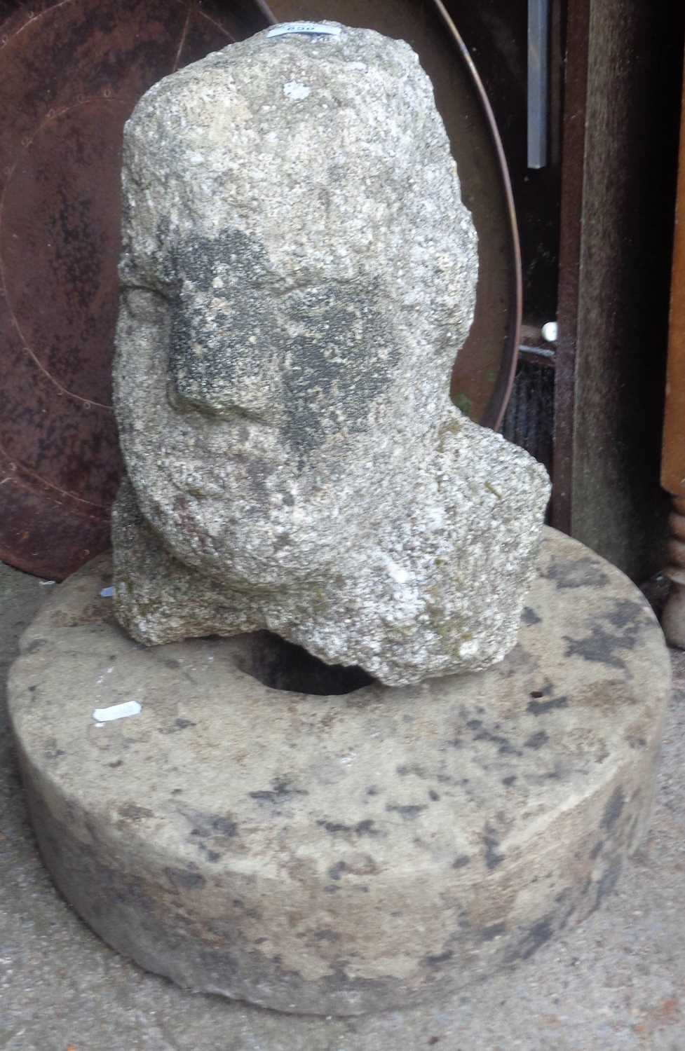 A Celtic stone head of a man, 14" tall, standing with an old grindstone - Image 2 of 2