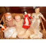 Two antique German porcelain headed baby dolls, a pin cushion doll and two others