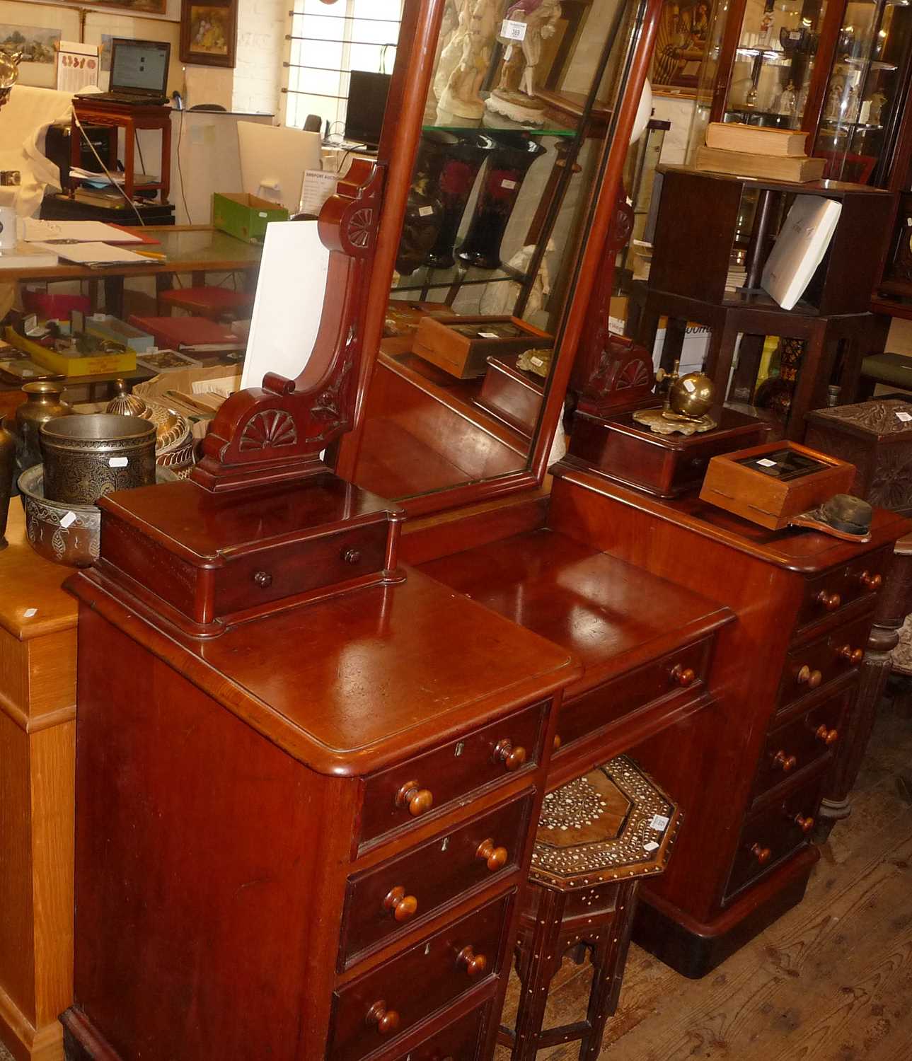 Victorian 19th c. mahogany kneehole dressing table with central drawer flanked by 8 drawers and