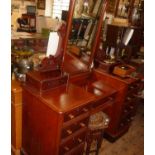 Victorian 19th c. mahogany kneehole dressing table with central drawer flanked by 8 drawers and