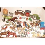 Britains and other farm figures with plough, milkman and cart, trees, fences, bridge, haystack,
