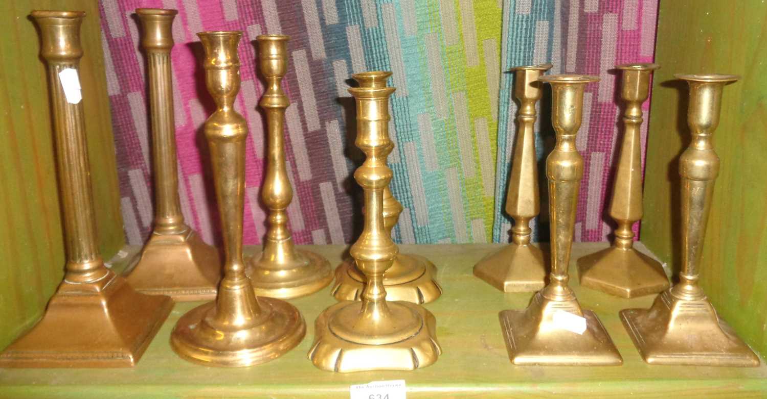 Five pairs of Victorian brass candlesticks