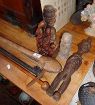 Tribal Art: African two bladed axe, and three various carved wood figures, etc.