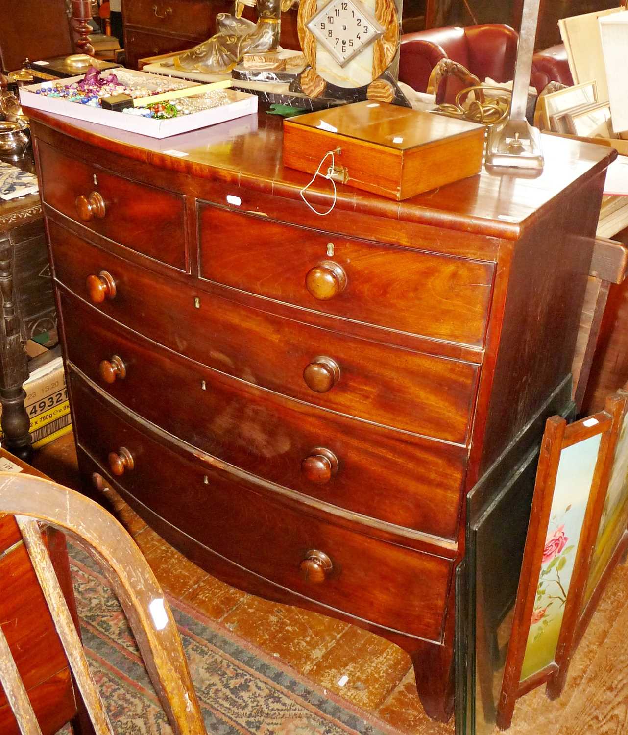 19th c. bow fronted 2 over 3 mahogany chest of drawers. Approx. 104cm high and 107cm wide