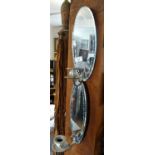 Pair of oval wall mirrors with candle sconces