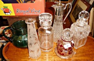 Four cut & etched glass decanters, claret jug, and green glass water jug