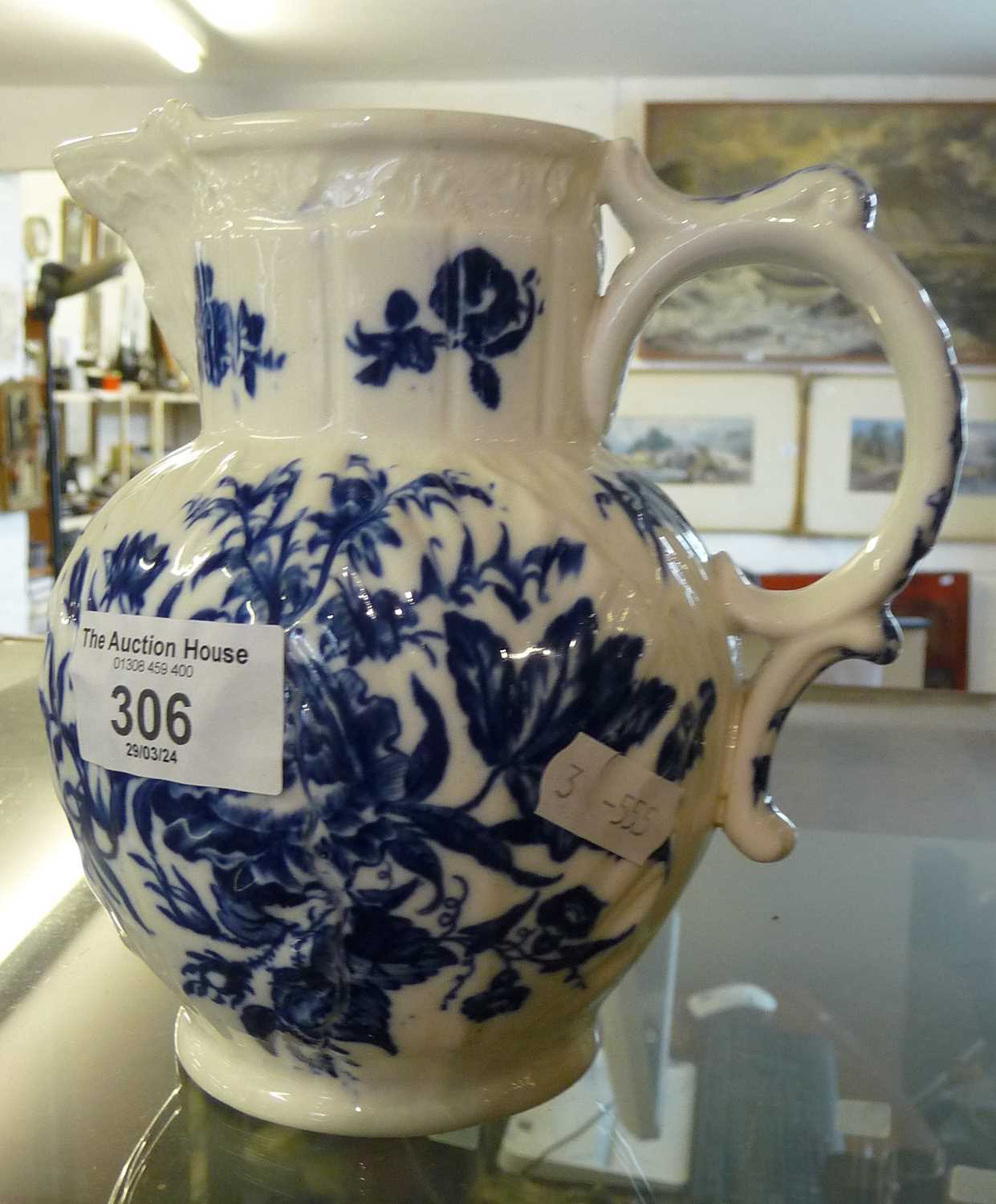 Worcester blue and white jug with floral and butterfly decoration, crescent mark, 15cm tall